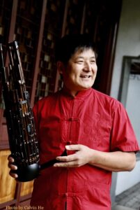 Zhongxi Wu holds a Sheng. Photo by Calvin He.